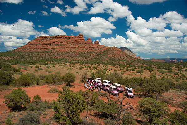 Wedding in Sedona - group of Pink Jeeps and people