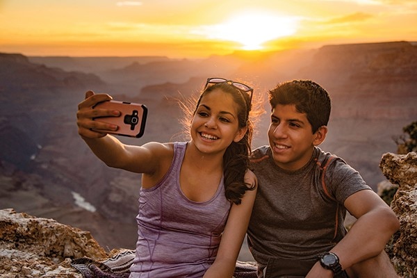 Kids taking selfie at Grand Canyon