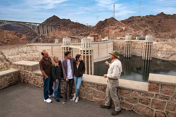 Tour group at Hoover Dam with Pink Jeep guide