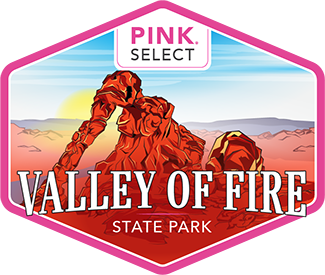 Pink Adventure Tours Pink Select Valley of Fire Tour badge logo.