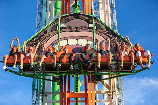 Riders in motion on The Gravity Bomb, a  200' free-fall ride at Bigfoot Fun Park, Branson, Mo.