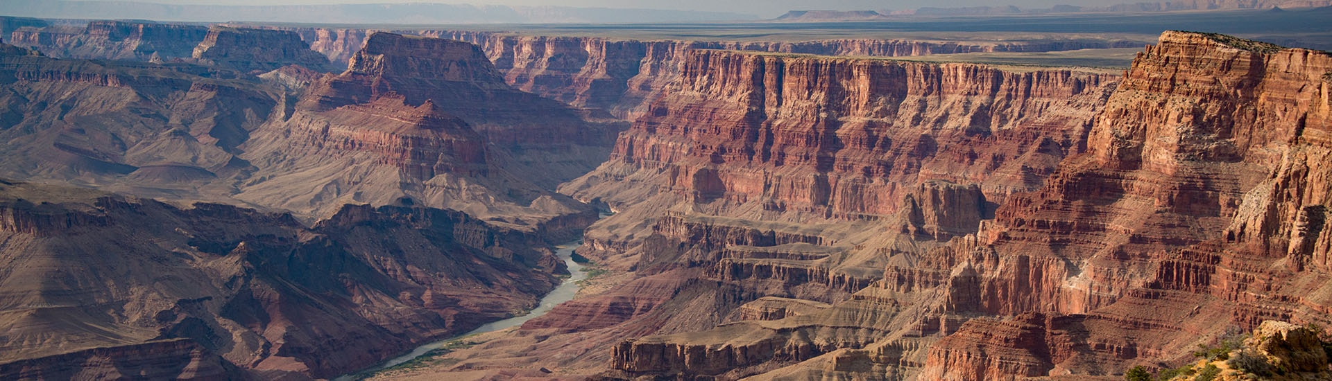 Landscape of Grand Canyon with the Colorado River below as it winds through the canyon.