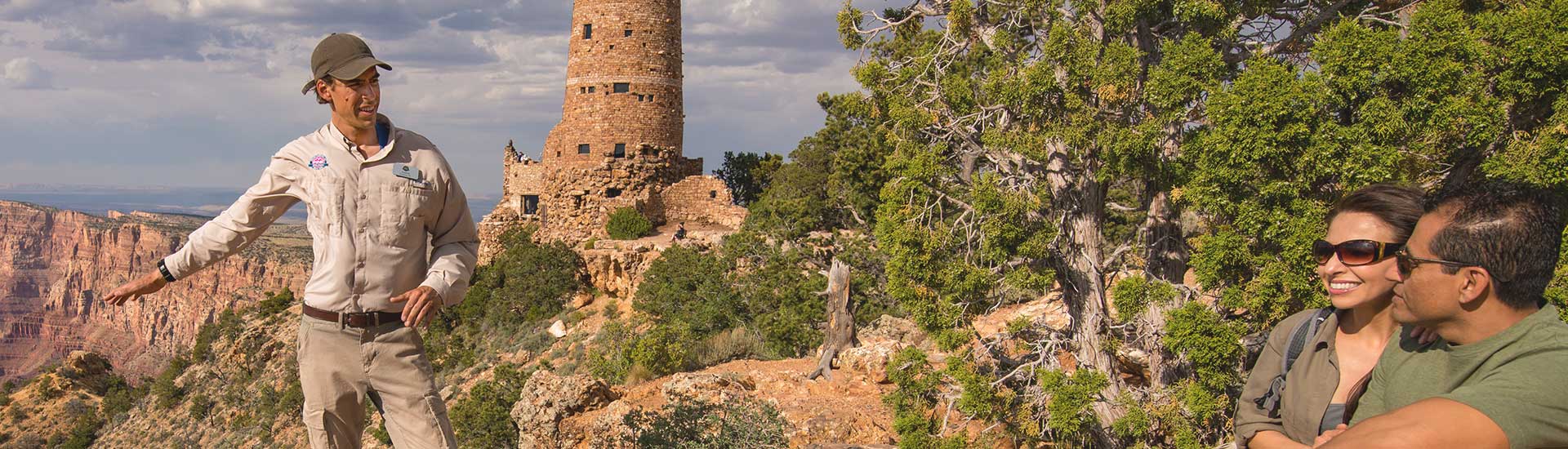 Pink Jeep Adventure Tours guide showing tourists the Grand Canyon