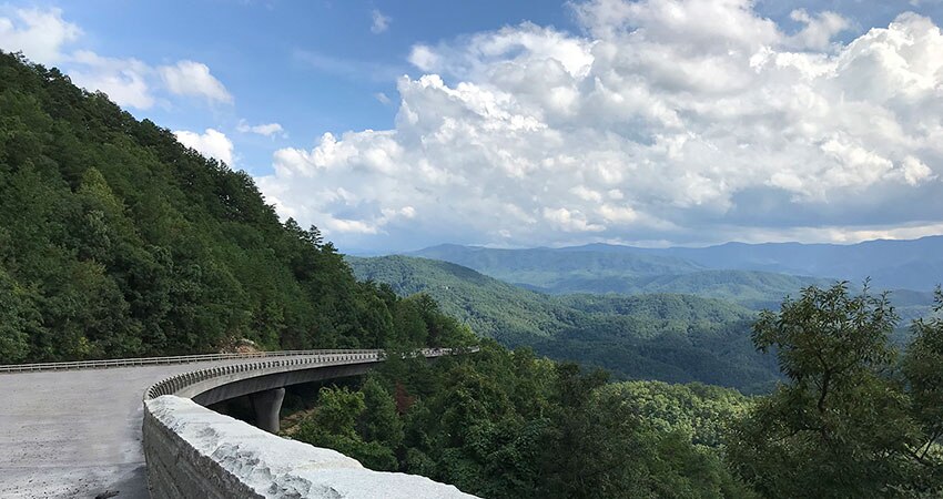 Beautiful panorama of Foothills Parkway and Great Smoky Mountains with blue sky, puffy white clouds