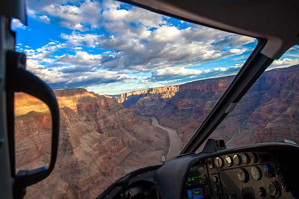Beautiful view of Grand Canyon with summer sky from helicopter window