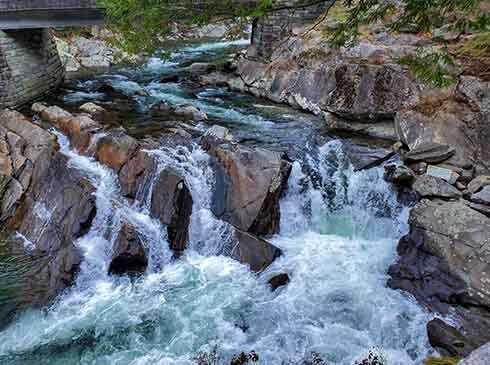 Close-up of water rushing down The Sinks waterfall, along Little River Gorge Road, Great Smoky Mountains National Park.