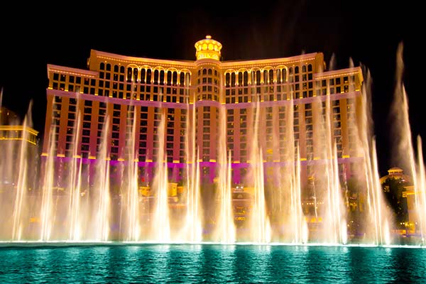 Nighttime view of choreographed fountains at Bellagio Hotel Casino, Las Vegas, NV