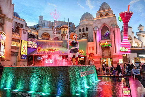 Interior view of Miracle Mile Shops shopping mall on Las Vegas Strip, with lighted water fountain and people.