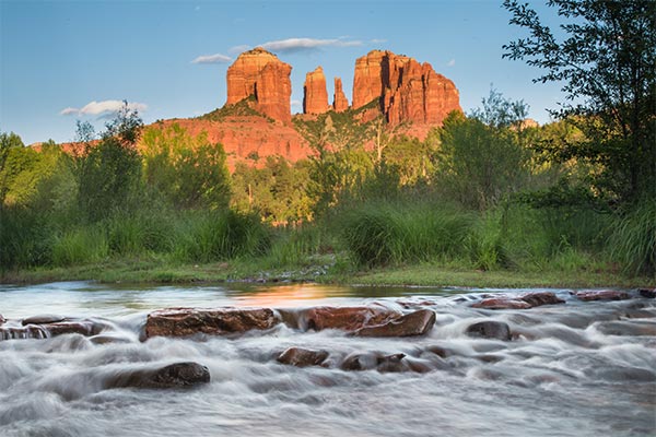 Sedona's rushing Oak Creek flows in the foreground of Cathedral Rock, as seen from Red Rock Crossing.