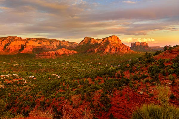 View Sedona and surrounding rock formations during sunset from Airport Mesa Vista.