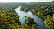 View of Lake Taneycomo from the Branson "165 Scenic Overlook" with Table Rock Dam in the distance.