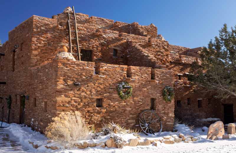 The Hope House, designed by Mary Colter (1905), at Grand Canyon National Park with the foreground covered in snow.