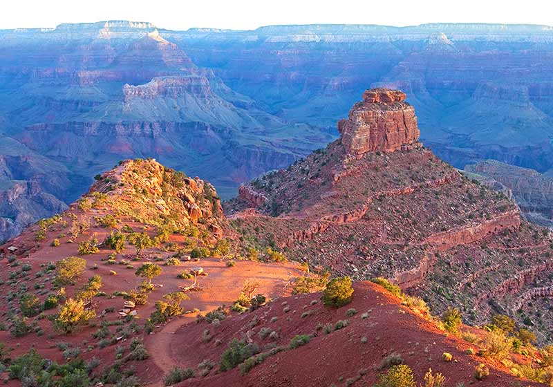 View of the South Kaibab Trail and O'Neill Butte in Grand Canyon National Park at sunrise.