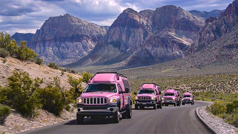 Pink Jeep Tour Trekkers on large group tour driving through Red Rock Canyon, Las Vegas, Nevada.