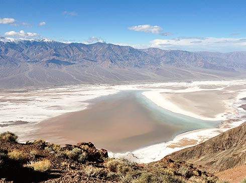 Looking down on Death Valley salt flats surrounded by mountains from  Dante's View, Death Valley National Park.