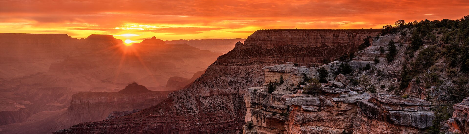 Orange sunrise from Mather Point overlooking the Grand Canyon South Rim, Arizona.