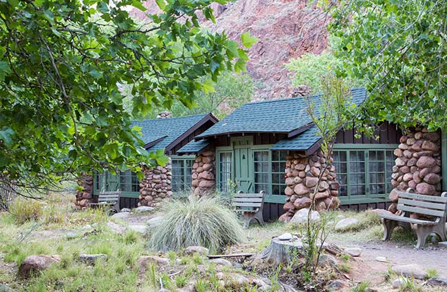 The wood and native stone cabins at Phantom Ranch, located on the floor of the Grand Canyon, blend with their natural surroundings.