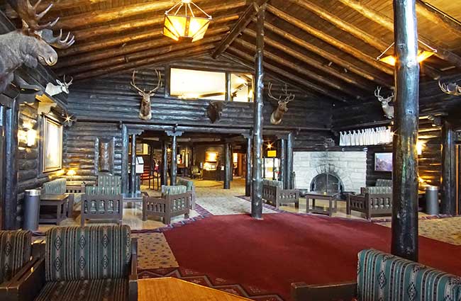 The rustic interior lobby of the the legendary El Tovar Hotel, the crown jewel of Historic National Park Lodges, Grand Canyon National Park.