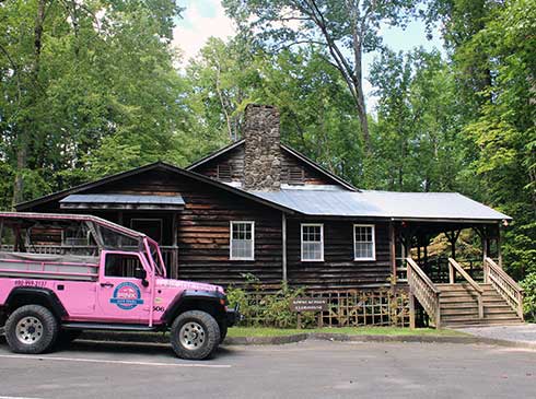Pink Jeep Tours Wrangler parked in front of the historic Appalachian Clubhouse, Great Smoky Mountains National Park. 