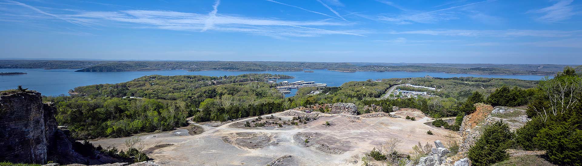 Panorama of Table Rock Lake and sandy quarry below Baird Mountain, from Pink Jeep Tours mountaintop viewpoint.