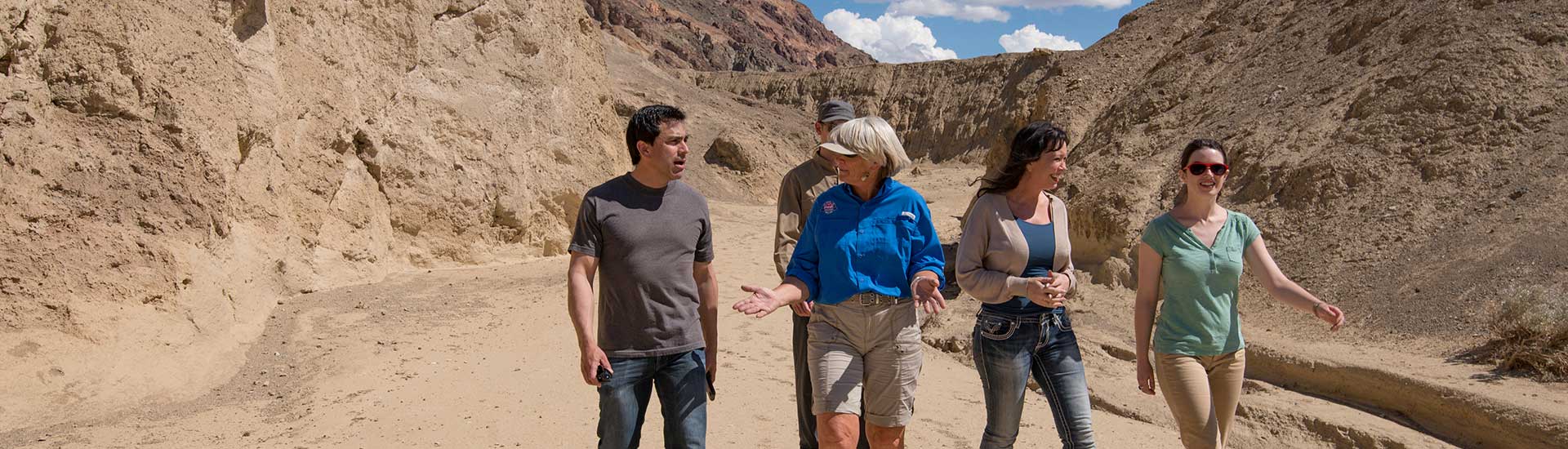 Tour guide and guests walking on a trail at Death Valley National Park, Pink Select Las Vegas to Death Valley premium journey