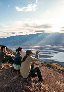 Tour guide and guests viewing sunset from Dante's View on Pink Jeep Death Valley Premium Journey from Las Vegas.