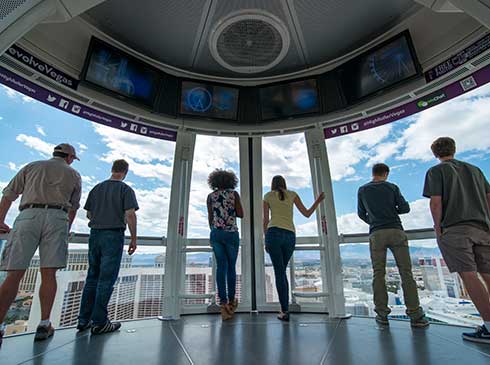 Pink Jeep guide and tour guests enjoy a bird's-eye from High Roller Observation Wheel on Las Vegas Strip