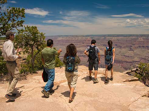 Grand Entrance Sunset guests enjoying a view along the South Rim