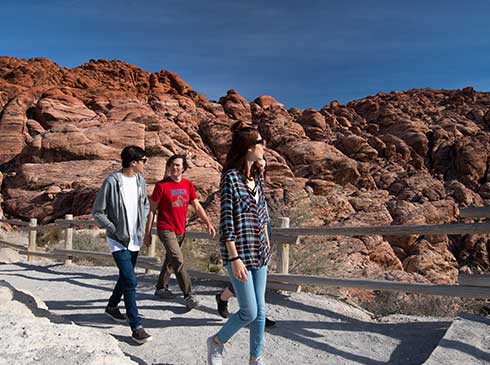 Small group walking the trail to the Red Rock Canyon Overlook