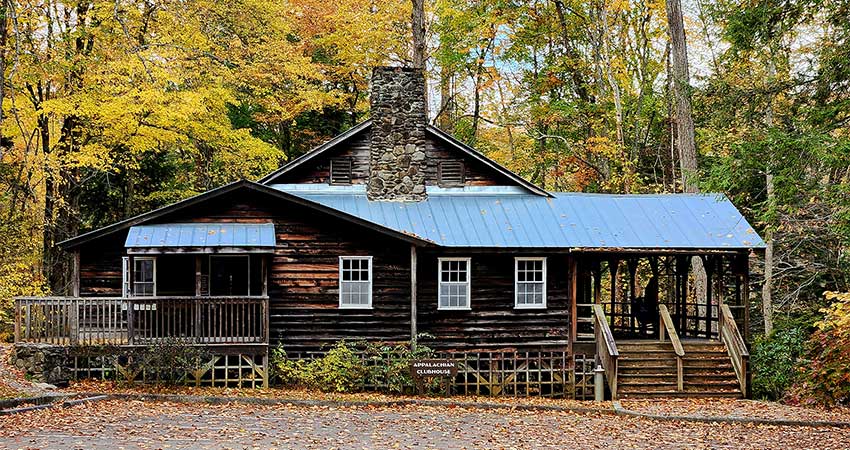 Autumn trees surround the historic Appalachian Clubhouse near Elkmont Ghost Town, Great Smoky Mountains National Park, TN.
