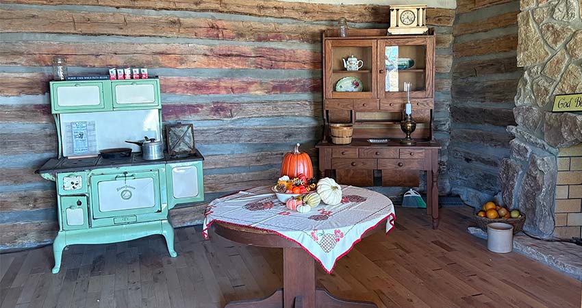 Baird Mountain cabin interior decorated with fall pumpkins, Pink Jeep Tours Branson Best of Branson adventure.