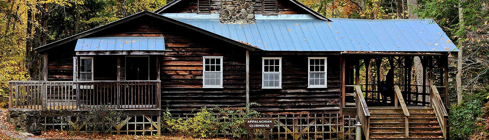 Autumn trees surround the historic Appalachian Clubhouse near Elkmont Ghost Town in the Great Smoky Mountains, Tennessee.