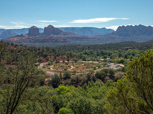 Aerial view of Red Rock State Park with views of Cathedral Rock and Courthouse Butte in the distance, Scenic Sedona State Park Loop tour.