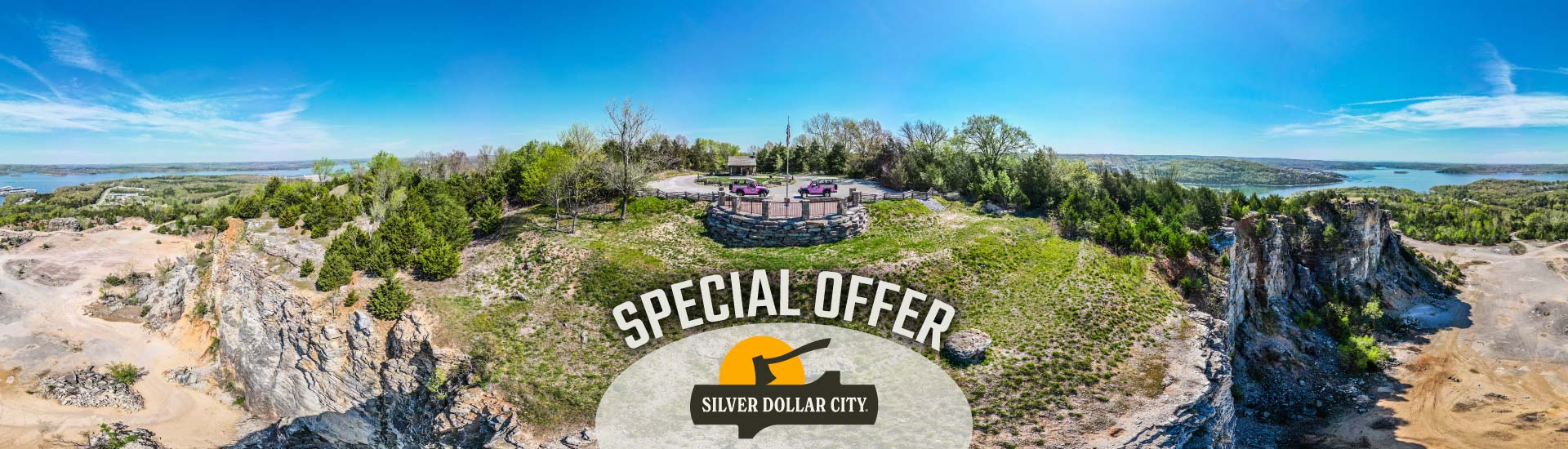 A panoramic, aerial view of Baird Mountain showing two Pink Jeeps at the summit and Table Rock Lake in the distance. A banner at the bottom reads "Special Offer" above the Silver Dollar City logo.