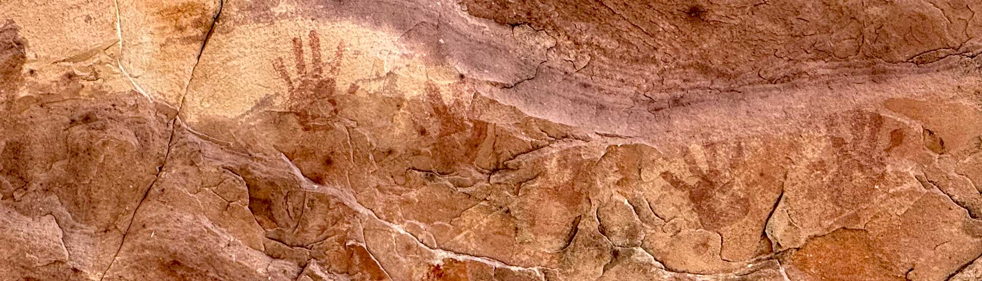 Five hand imprints on a pictograph rock at Wilson Cliffs in the Red Rock Canyon National Conservation Area, Pink Jeep Tours Las Vegas.